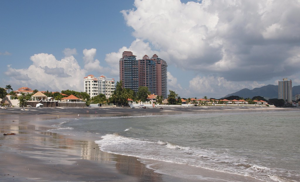 An image of a Coronado Panama beach with several properties along the shore. One of amazing locations on a senior trip to Panama. 