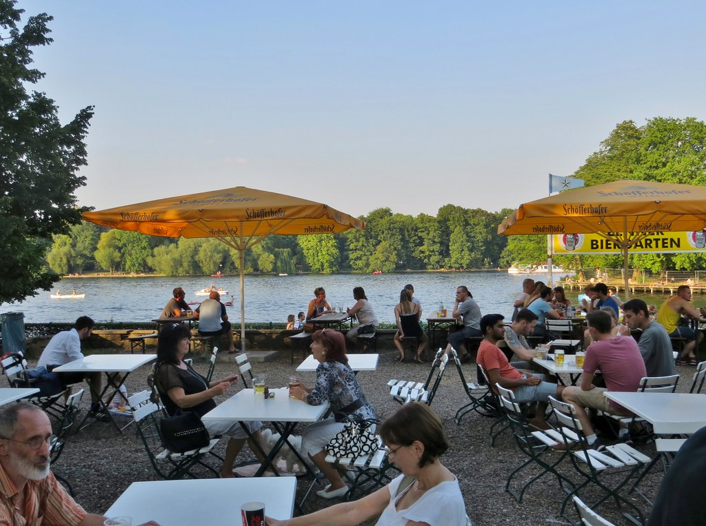 An image of tourists visiting a popular beer garden in Berlin.