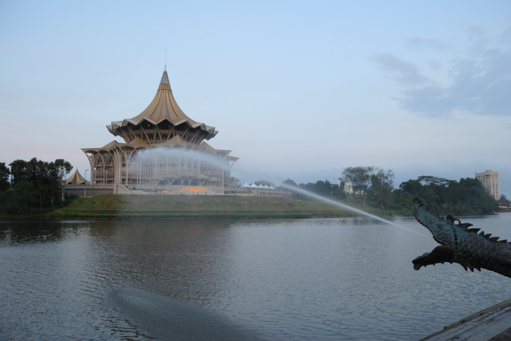 An image of the Kuching Waterfront and the Sarawak Parliament building.