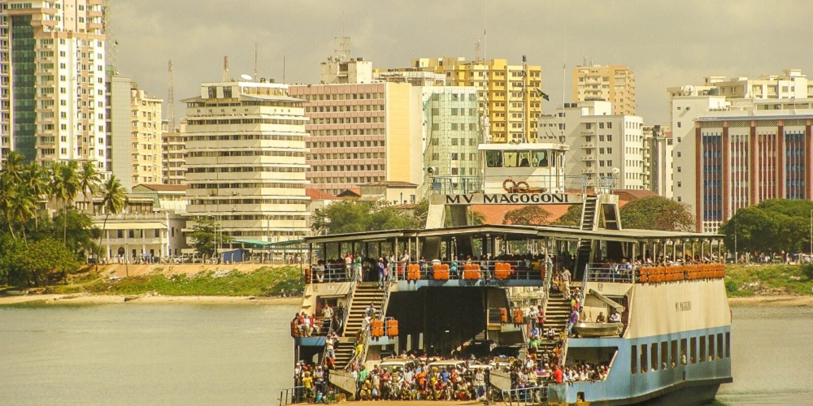 An image of tourists riding the Kigamboni ferry for the topic about senior vacation to Dar es Salaam.