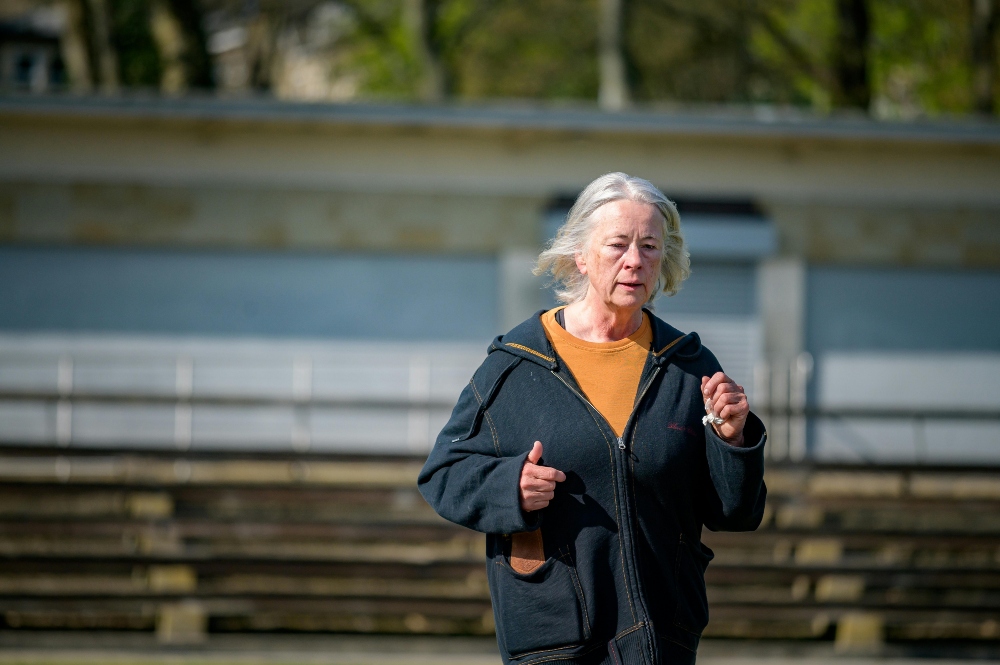 An elderly jogging.