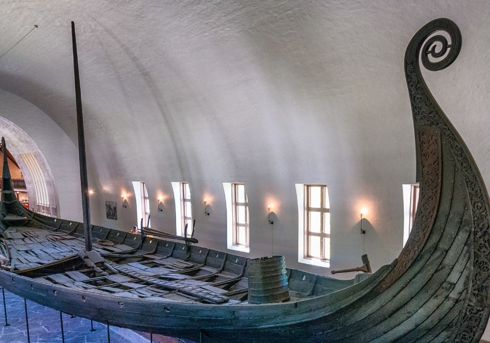 An image of a preserved Viking vessel at the The Viking Ship Museum. 