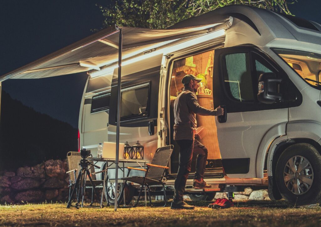 An image of a senior getting inside of an RV. 