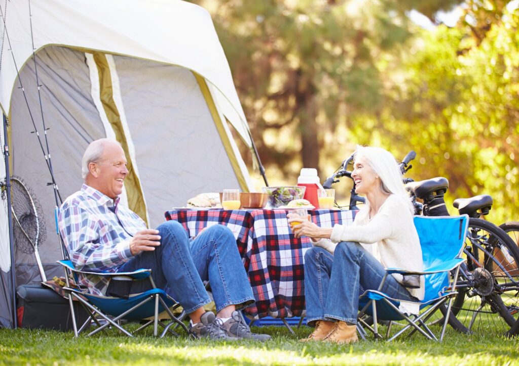 A couple enjoying the perks of senior camping adventures.